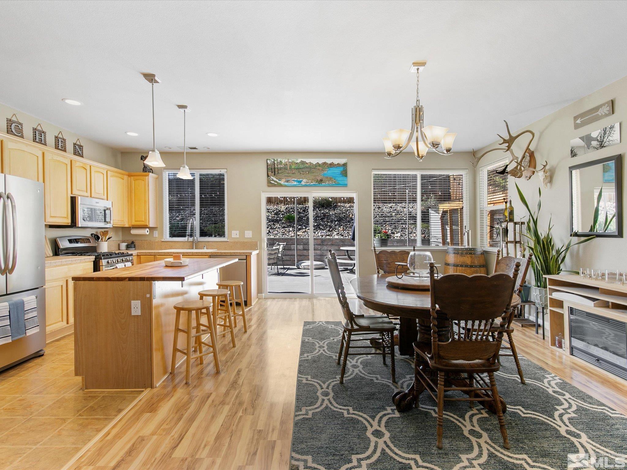 3448 Weaver Place Reno, NV 89512 - Photo 7 of 34 a view of a dining room with furniture window and outside view
