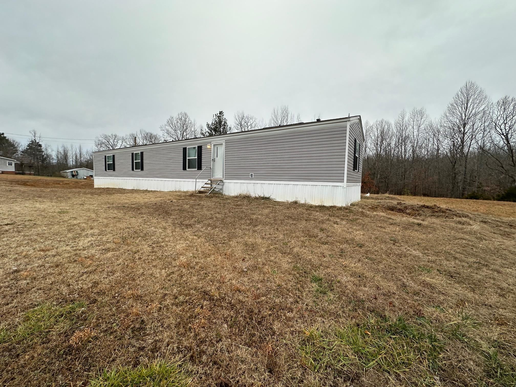 1696 Hardin Graveyard Road Adamsville, TN 38310 - Photo 16 of 25 a view of a house with a yard
