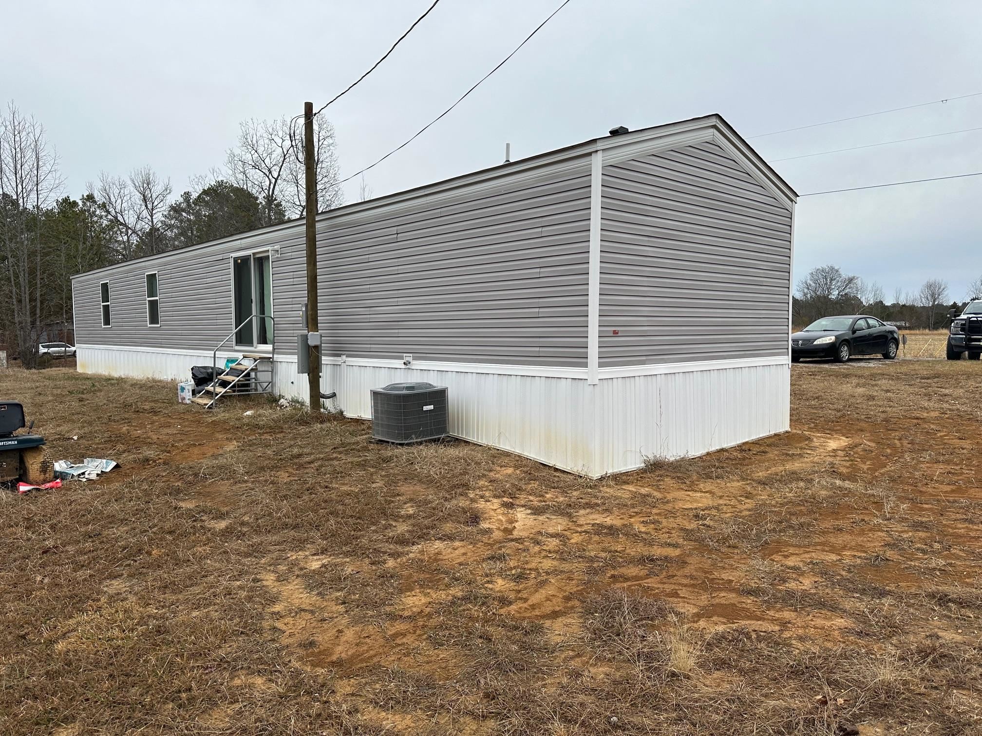 1696 Hardin Graveyard Road Adamsville, TN 38310 - Photo 24 of 25 a view of a house with backyard and sitting area