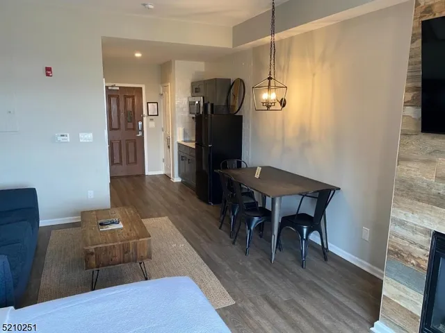 a kitchen with a wooden table and chairs
