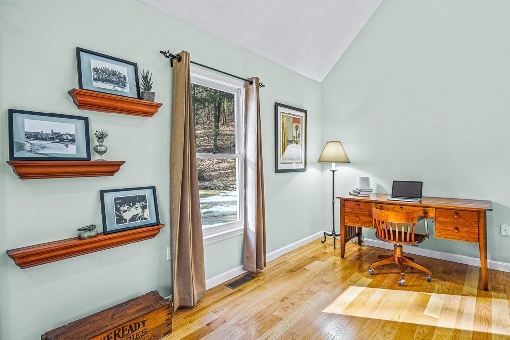 18 Ravens Bluff Andover, MA 01810 - Photo 12 of 41 a living room with furniture and a table
