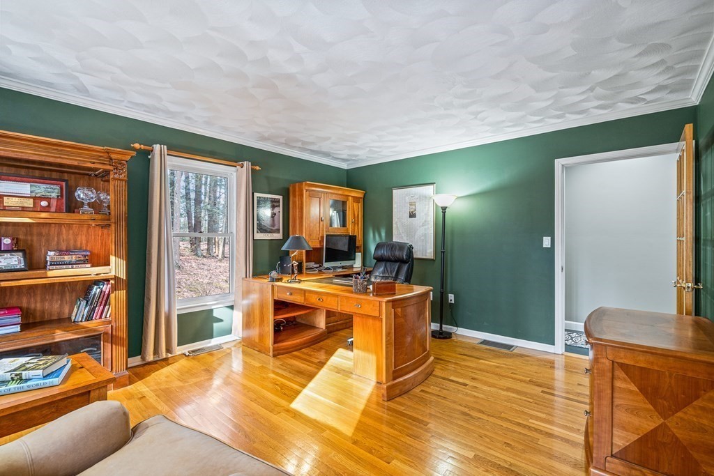 18 Ravens Bluff Andover, MA 01810 - Photo 16 of 41 a large living room with stainless steel appliances lots of white furniture a rug and a large window