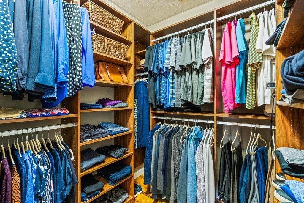 18 Ravens Bluff Andover, MA 01810 - Photo 24 of 41 a view of walk in closet with clothes and shoes