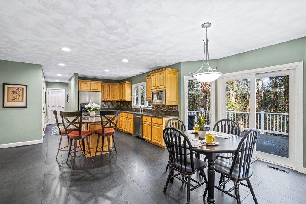 18 Ravens Bluff Andover, MA 01810 - Photo 3 of 41 a view of a dining room with furniture window and outside view