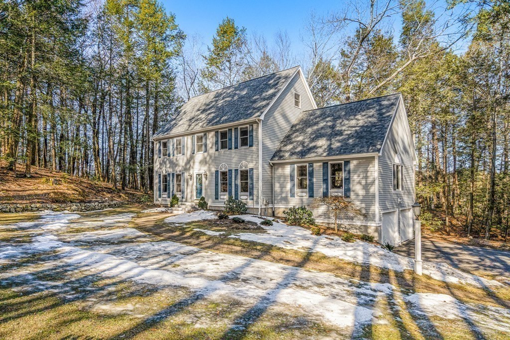 18 Ravens Bluff Andover, MA 01810 - Photo 35 of 41 a view of a house with a yard covered in snow