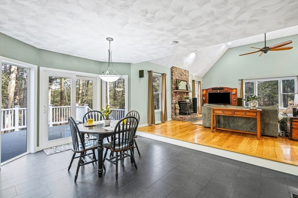 18 Ravens Bluff Andover, MA 01810 - Photo 7 of 41 a view of a dining room with furniture window and wooden floor