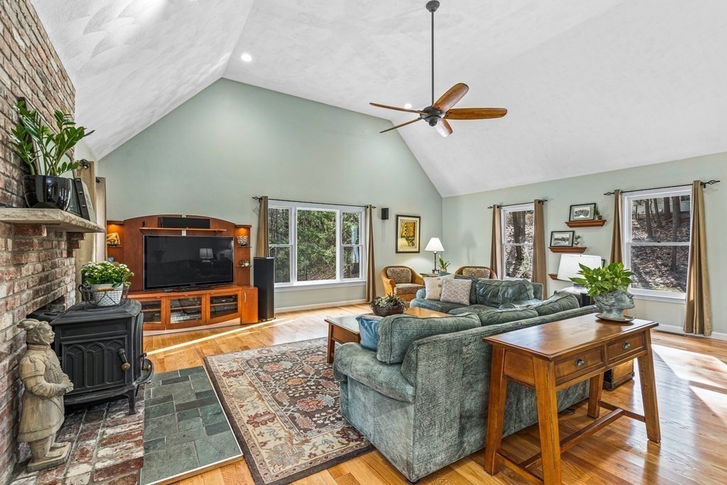 18 Ravens Bluff Andover, MA 01810 - Photo 8 of 41 a living room with furniture and a flat screen tv