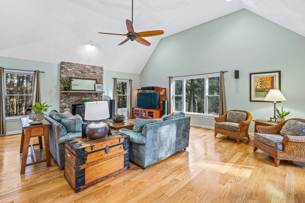 18 Ravens Bluff Andover, MA 01810 - Photo 9 of 41 a living room with furniture and a flat screen tv