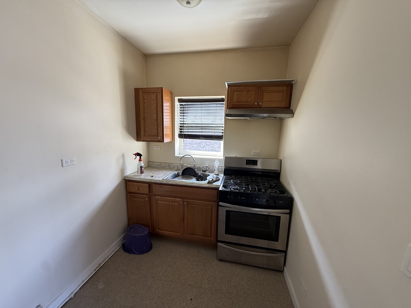 830 North Springfield Avenue Chicago, IL 60651 - Photo 18 of 31 a kitchen with stainless steel appliances a stove and a microwave