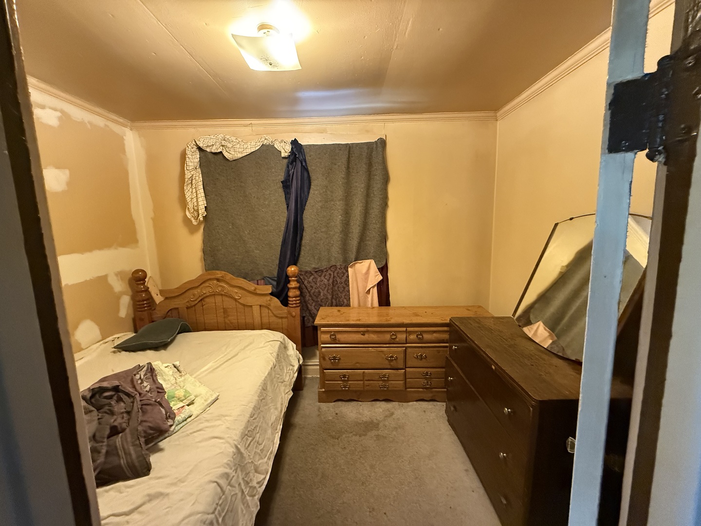830 North Springfield Avenue Chicago, IL 60651 - Photo 20 of 31 a bed sitting in a bedroom next to a window