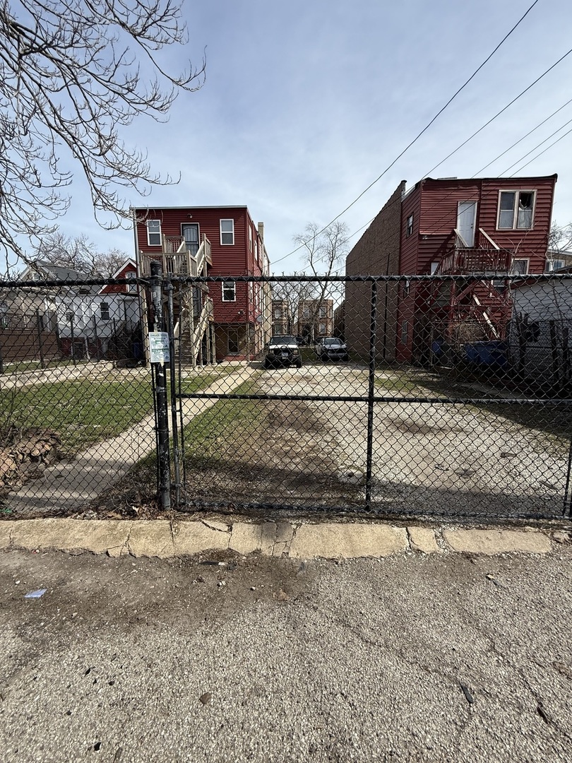 830 North Springfield Avenue Chicago, IL 60651 - Photo 2 of 31 a front view of a house with garden