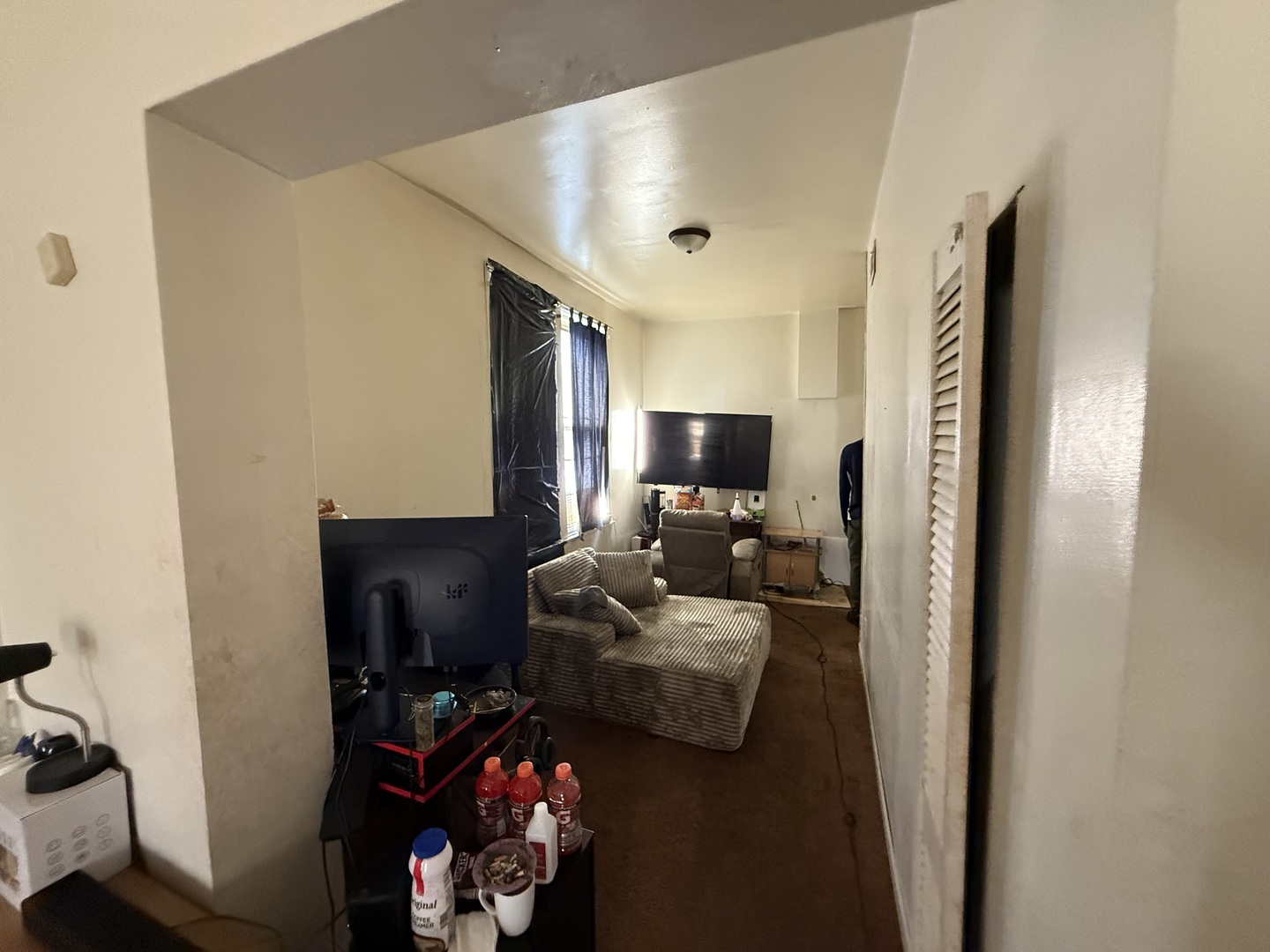 830 North Springfield Avenue Chicago, IL 60651 - Photo 28 of 31 a living room with furniture a flat screen tv and a window