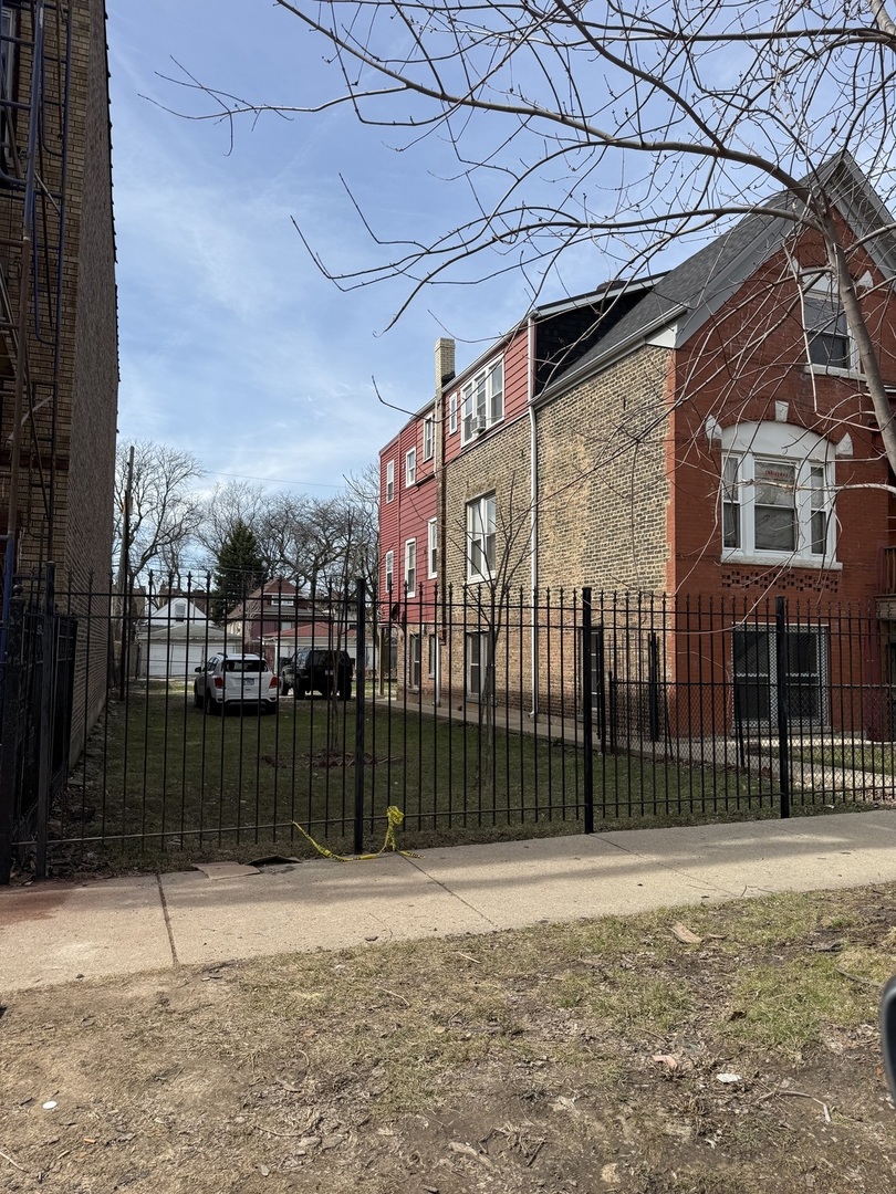 830 North Springfield Avenue Chicago, IL 60651 - Photo 3 of 31 a view of a house with a backyard