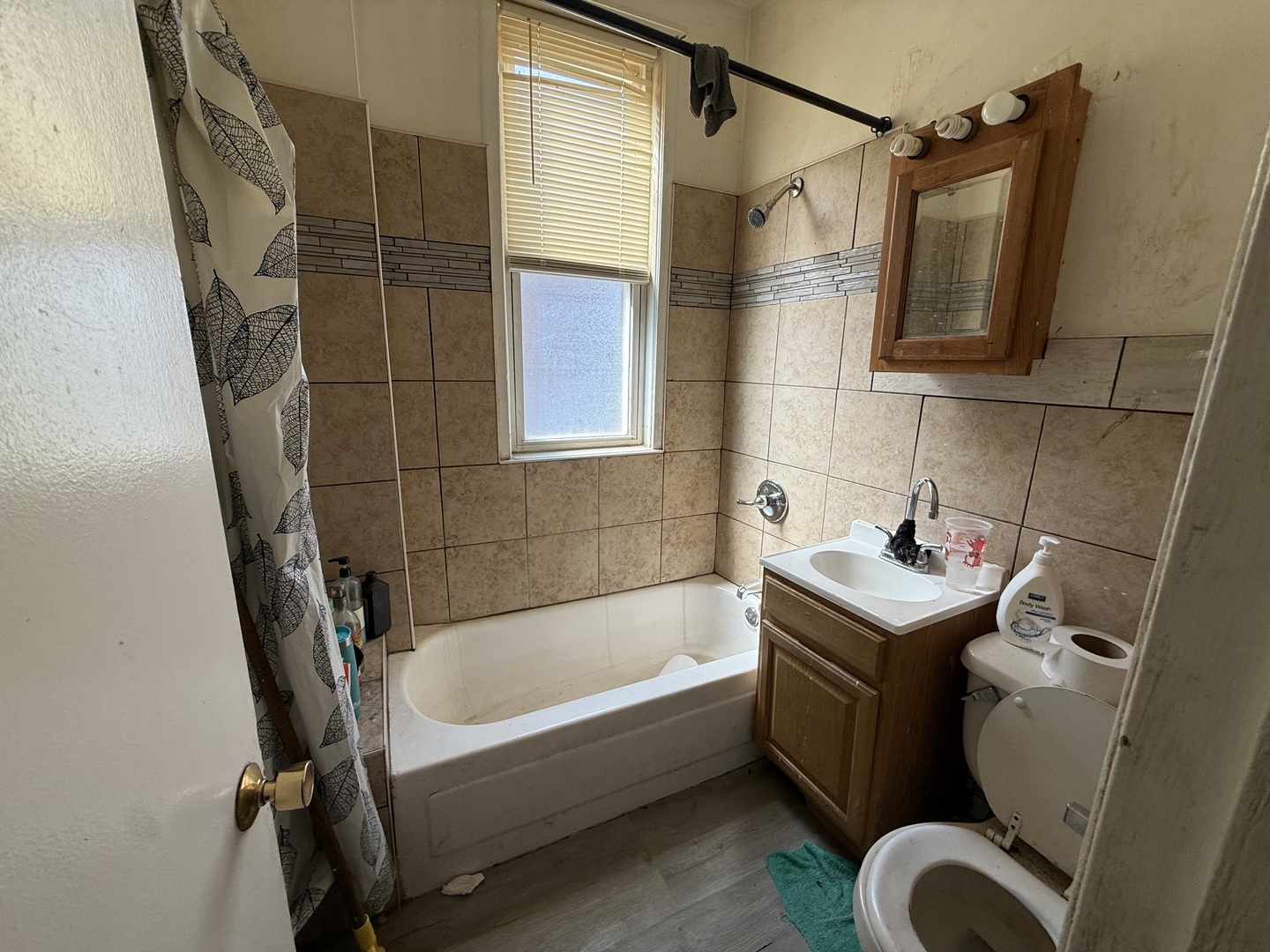 830 North Springfield Avenue Chicago, IL 60651 - Photo 31 of 31 a bathroom with a sink a toilet and shower