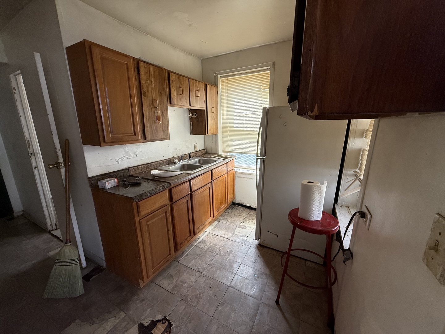 830 North Springfield Avenue Chicago, IL 60651 - Photo 7 of 31 a kitchen with stainless steel appliances a refrigerator stove and sink