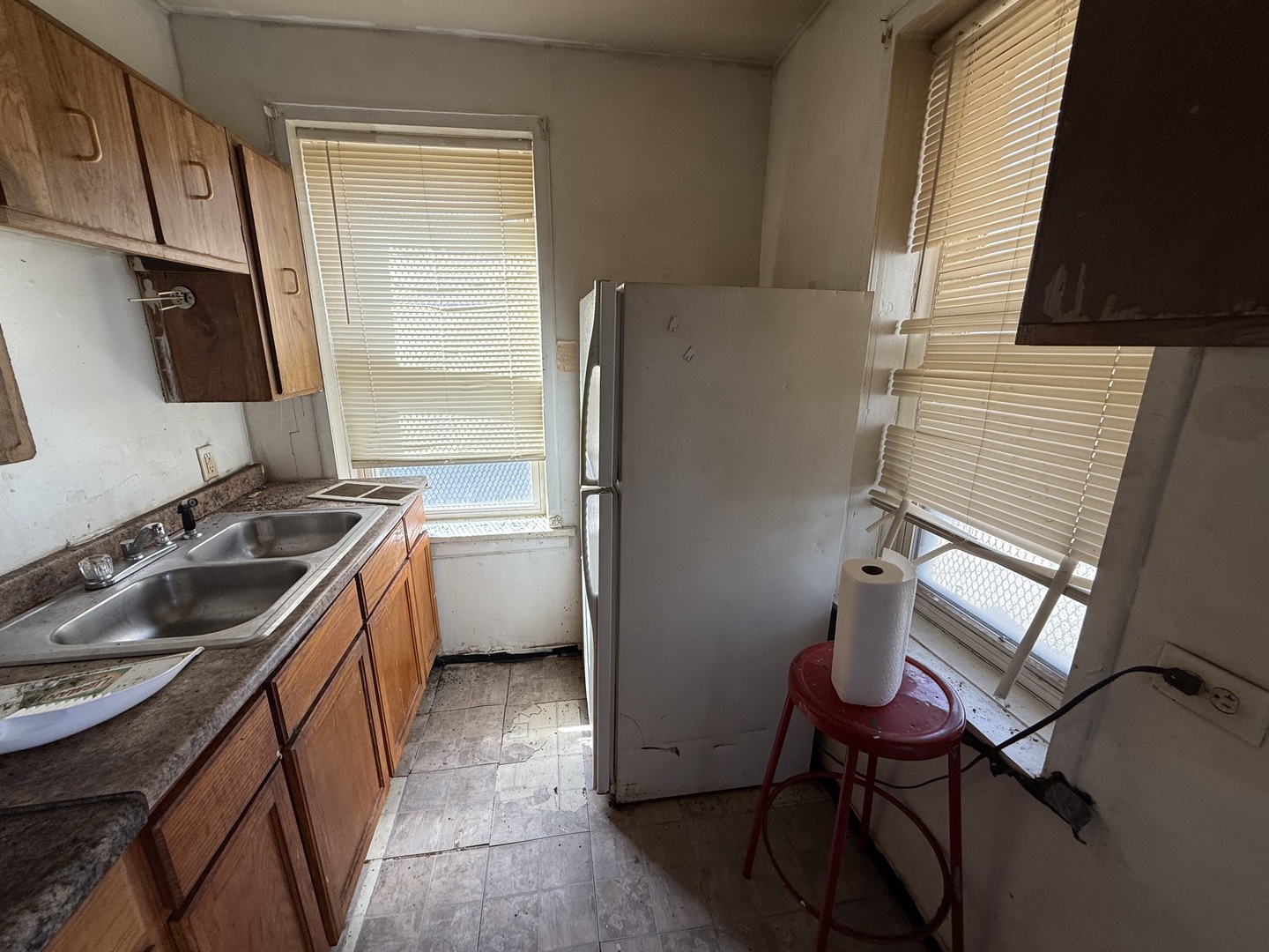 830 North Springfield Avenue Chicago, IL 60651 - Photo 9 of 31 a kitchen that has a sink a stove and a refrigerator
