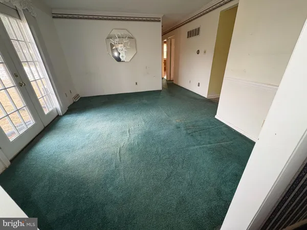 a bathroom with a granite countertop toilet sink and mirror