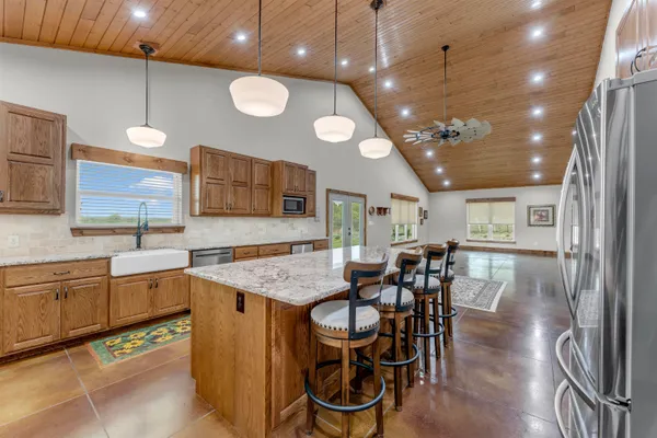 a kitchen with a table and chairs in it