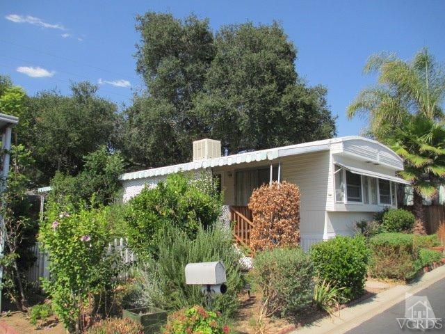 1225 South Rice Road, Unit 5 Ojai, CA 93023 - Photo 2 of 41 a front view of a house with a yard and fountain