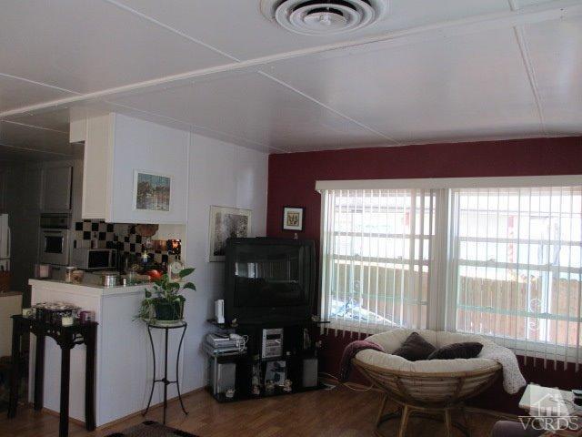 1225 South Rice Road, Unit 5 Ojai, CA 93023 - Photo 14 of 41 a living room with furniture and a floor to ceiling window