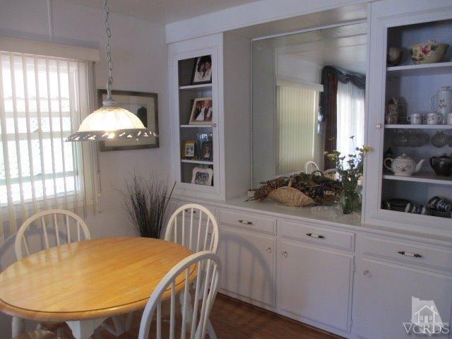 1225 South Rice Road, Unit 5 Ojai, CA 93023 - Photo 16 of 41 a view of a dining room with furniture and chandelier