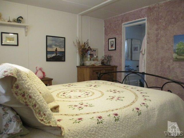 1225 South Rice Road, Unit 5 Ojai, CA 93023 - Photo 20 of 41 a bedroom with a bed and dresser