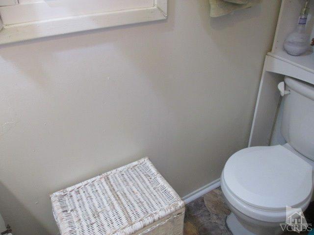 1225 South Rice Road, Unit 5 Ojai, CA 93023 - Photo 22 of 41 a white toilet sitting next to a white cabinet