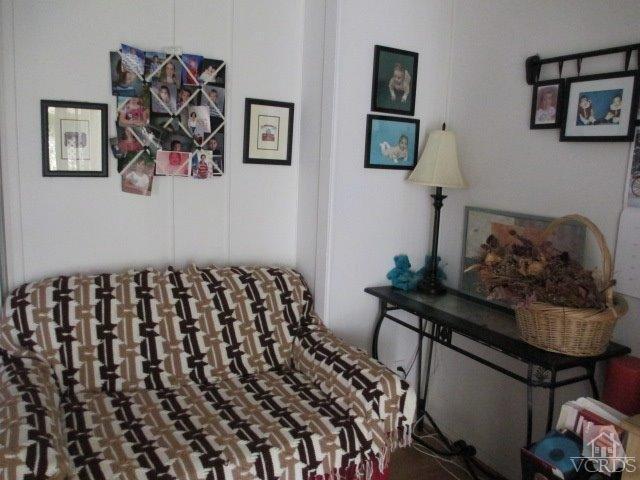1225 South Rice Road, Unit 5 Ojai, CA 93023 - Photo 25 of 41 a bedroom with a bed and wall painting