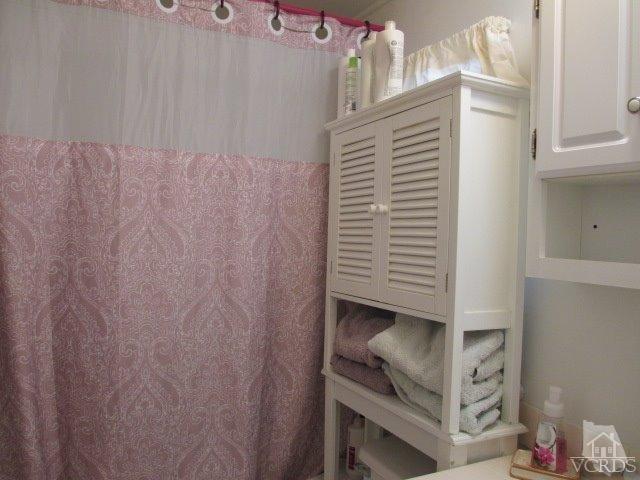 1225 South Rice Road, Unit 5 Ojai, CA 93023 - Photo 29 of 41 a view of room with cabinets and stairs