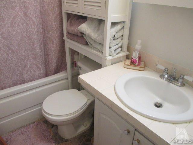 1225 South Rice Road, Unit 5 Ojai, CA 93023 - Photo 30 of 41 a bathroom with a toilet and a sink