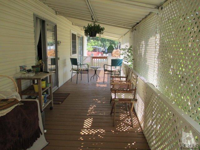 1225 South Rice Road, Unit 5 Ojai, CA 93023 - Photo 7 of 41 a view of a porch with chairs and potted plants