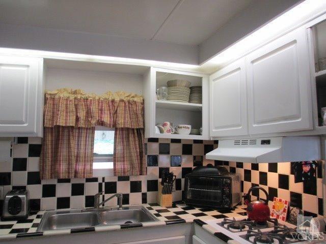 1225 South Rice Road, Unit 5 Ojai, CA 93023 - Photo 10 of 41 a kitchen with lots of appliances and cabinets
