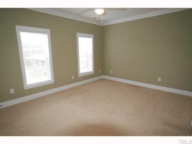 1209 North Blount Street Raleigh, NC 27604 - Photo 9 of 12 Bright Master Bedroom with Crown Molding & Ceiling Fan.