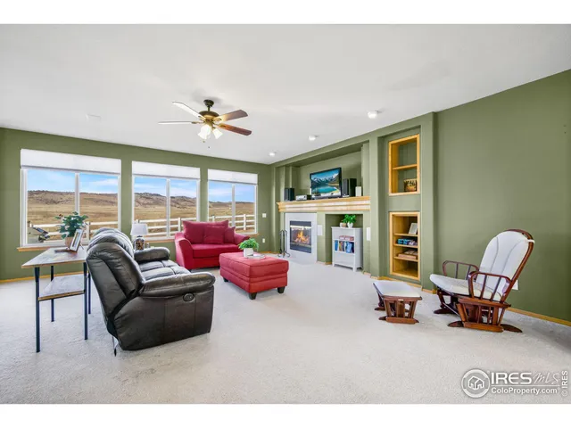 a kitchen with stainless steel appliances granite countertop a stove top oven a refrigerator a sink and dishwasher with wooden floor