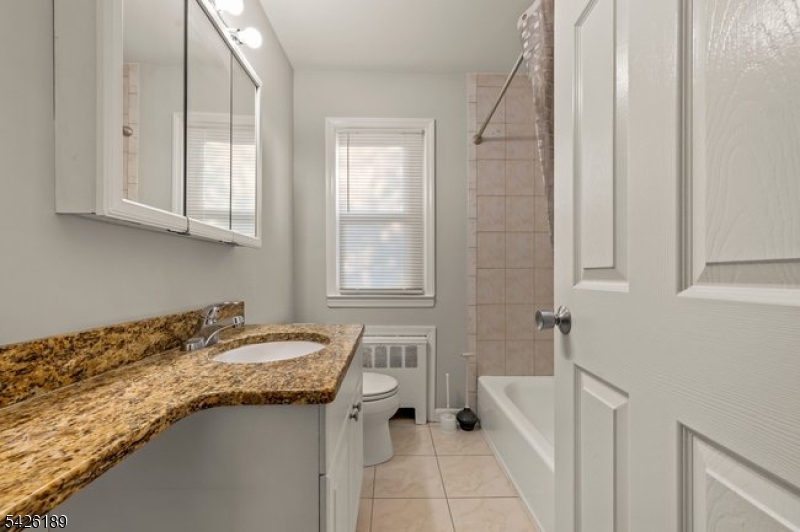 47 River Road Chatham, NJ 07928 - Photo 11 of 21 a bath room with a sink and a bath tub