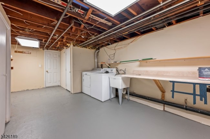 47 River Road Chatham, NJ 07928 - Photo 16 of 21 a utility room with dryer and washer