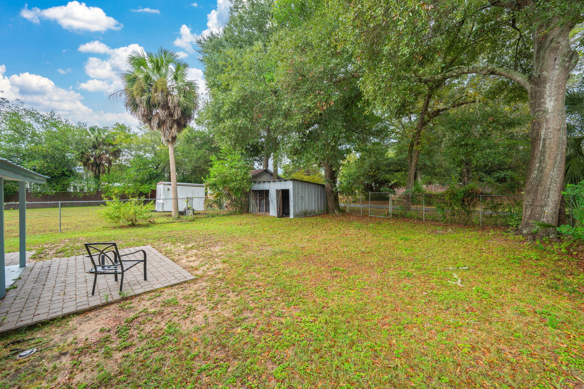 346 Crescent Drive DeFuniak Springs, FL 32435 - Photo 31 of 32 a view of a swimming pool with a patio