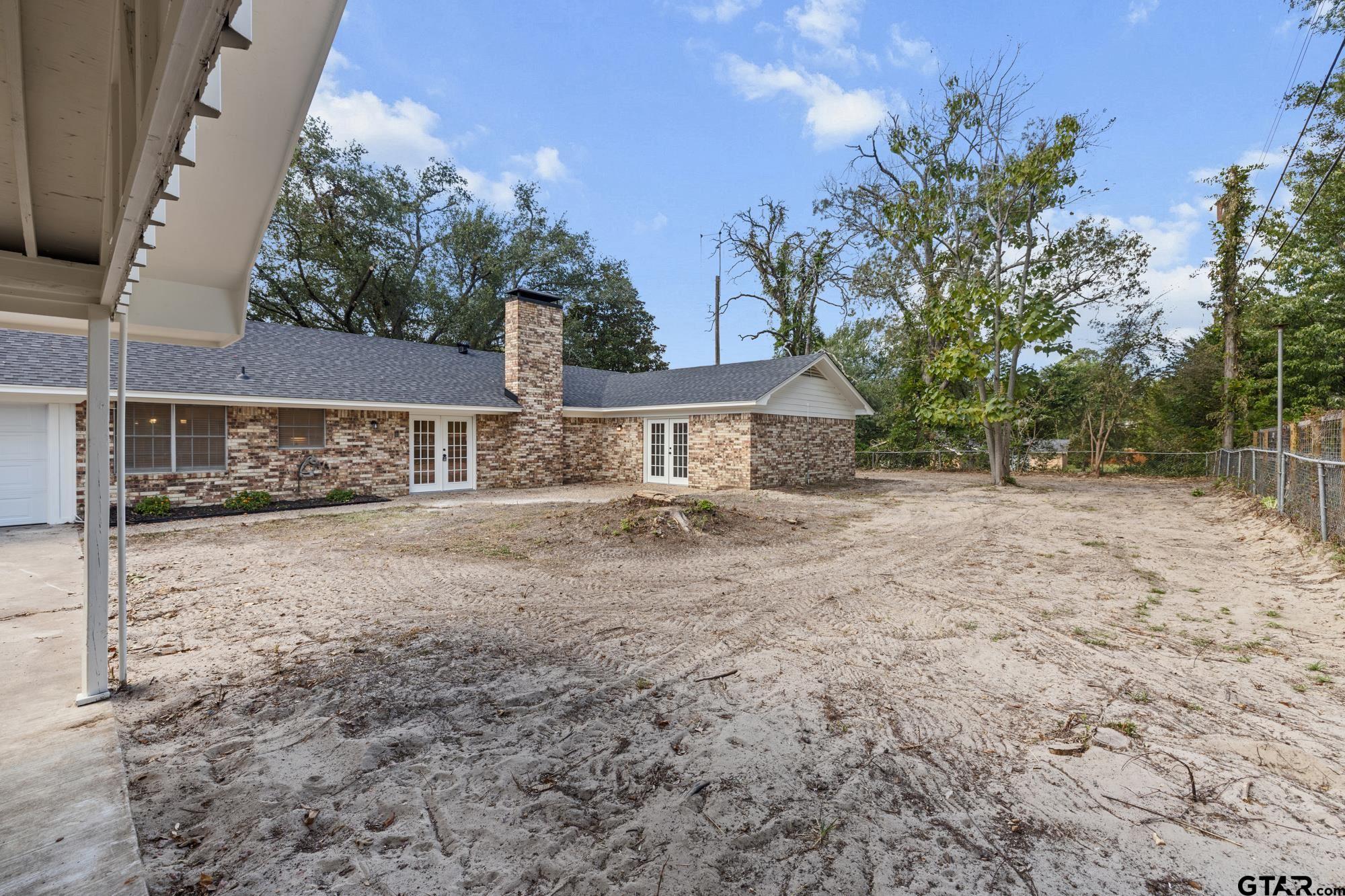 810 Pineland Lane Lindale, TX 75771 - Photo 28 of 42 a front view of a house with a yard and garage