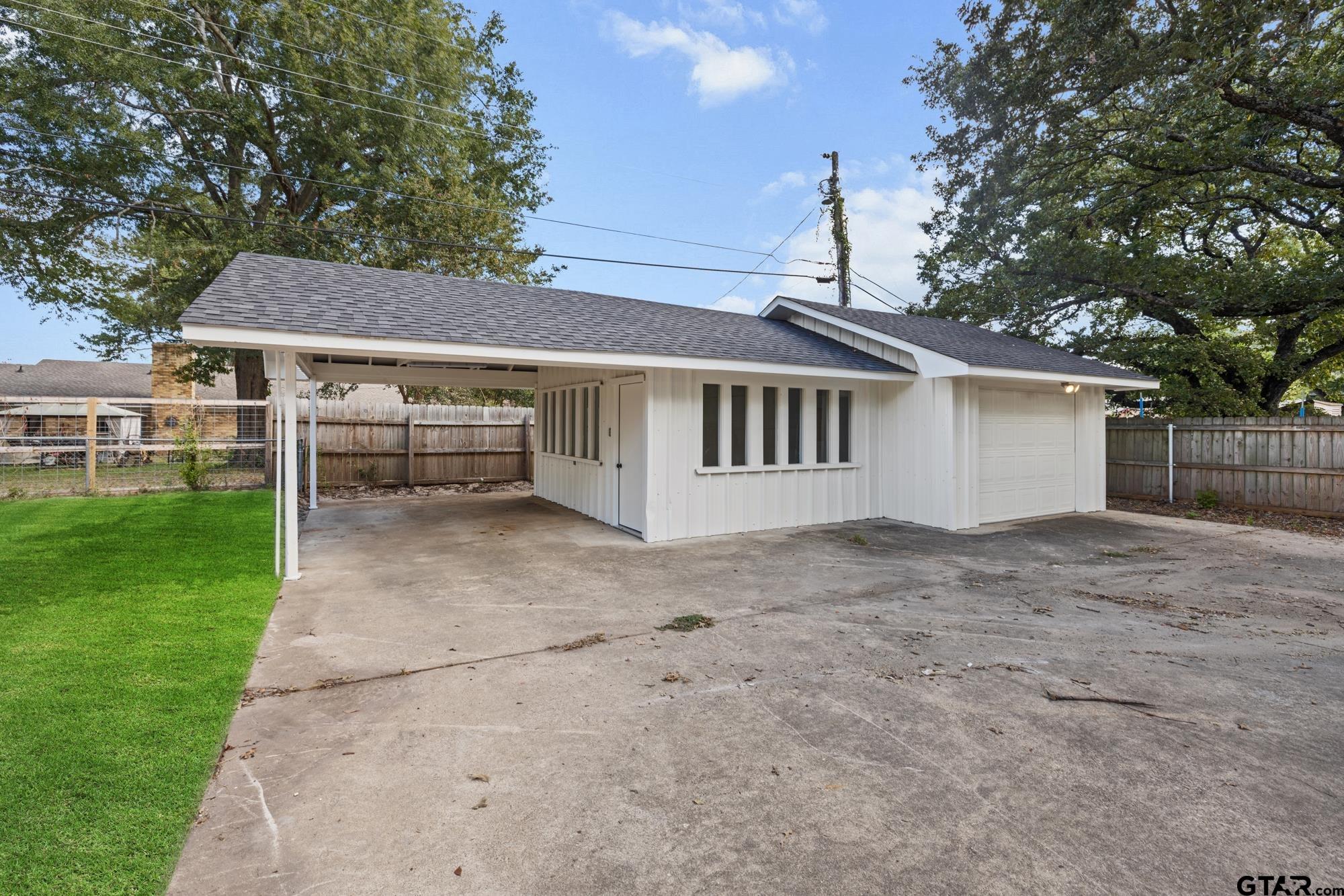 810 Pineland Lane Lindale, TX 75771 - Photo 31 of 42 a view of a house with a yard