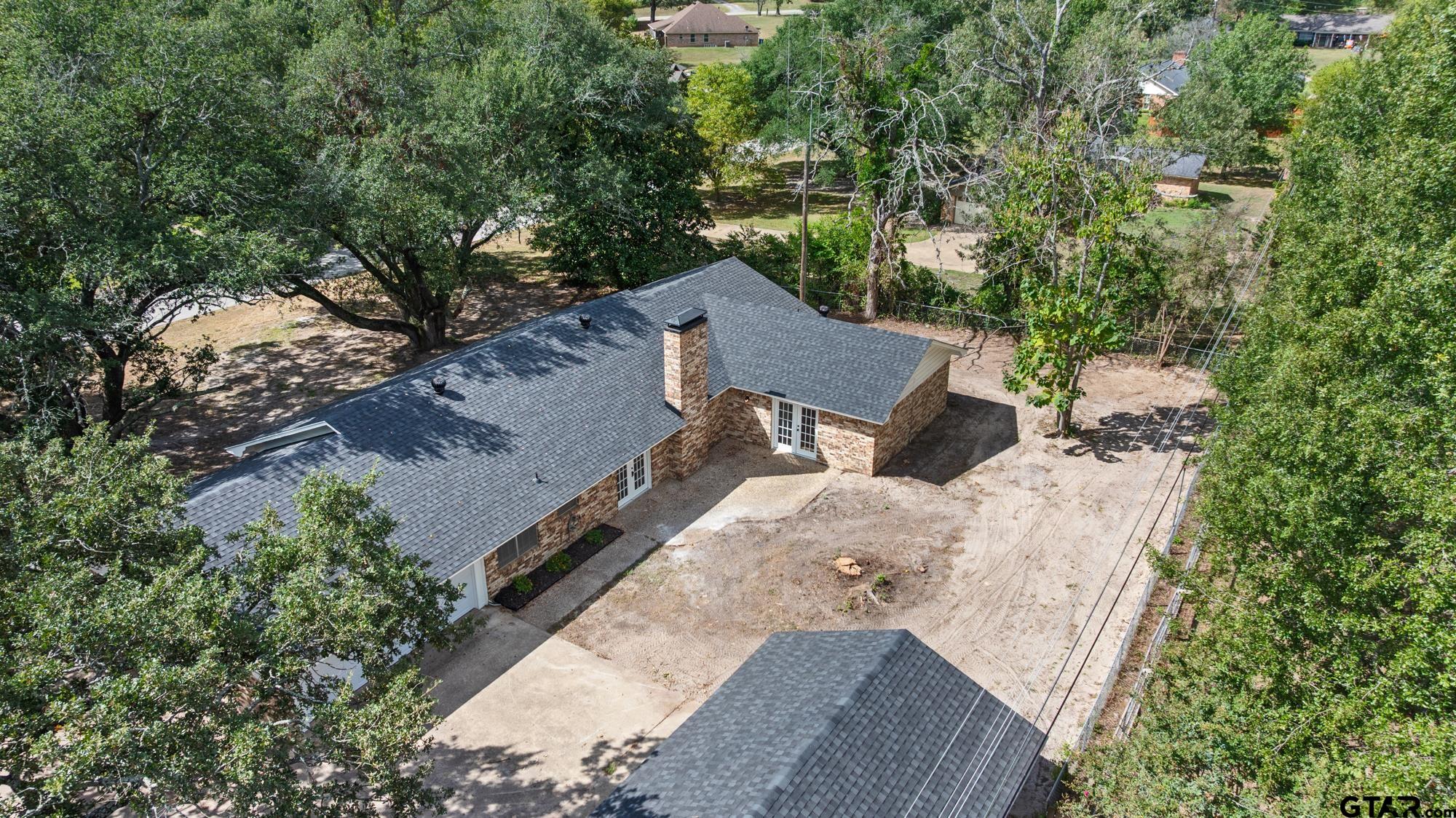 810 Pineland Lane Lindale, TX 75771 - Photo 36 of 42 an aerial view of a house with outdoor space