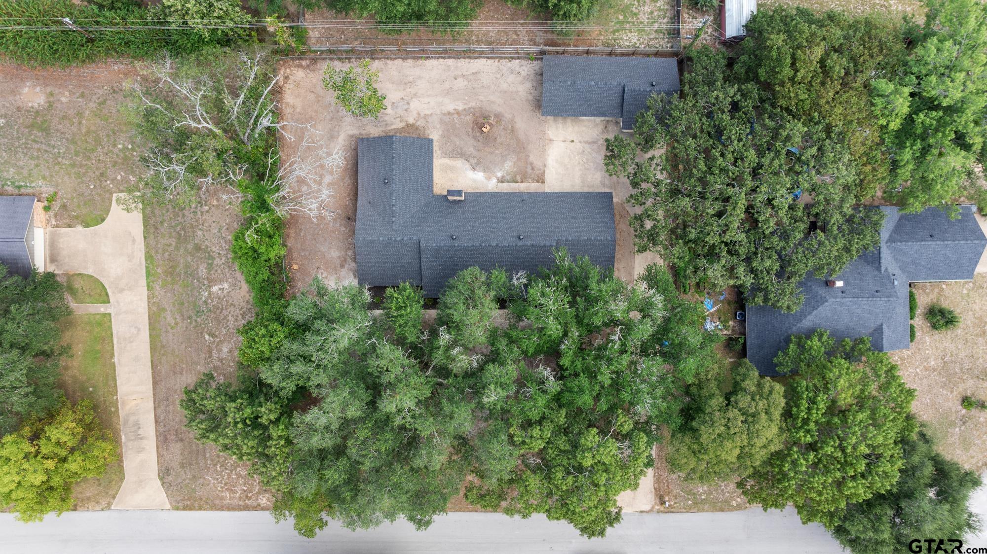 810 Pineland Lane Lindale, TX 75771 - Photo 38 of 42 an aerial view of a house with a garden and lake view