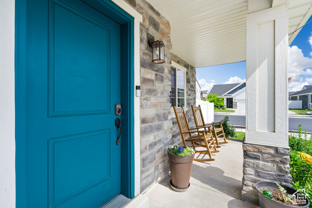 3456 South Linden Way Syracuse, UT 84075 - Photo 5 of 50 Doorway to property with a porch and stone siding