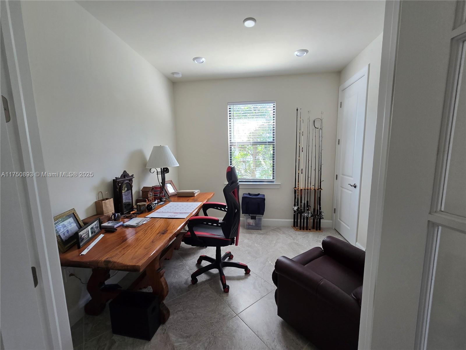 Ave Maria Immokalee, FL 34142 - Photo 16 of 21 a view of a workspace with furniture and a window
