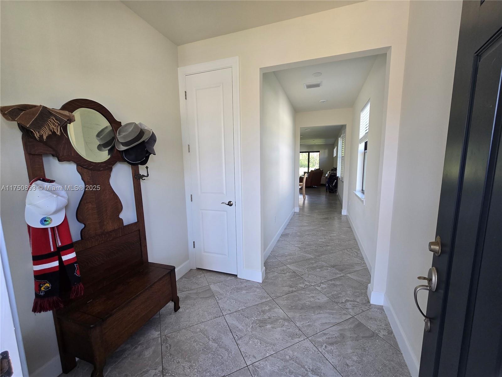 Ave Maria Immokalee, FL 34142 - Photo 3 of 21 a view of entryway and hall with wooden floor