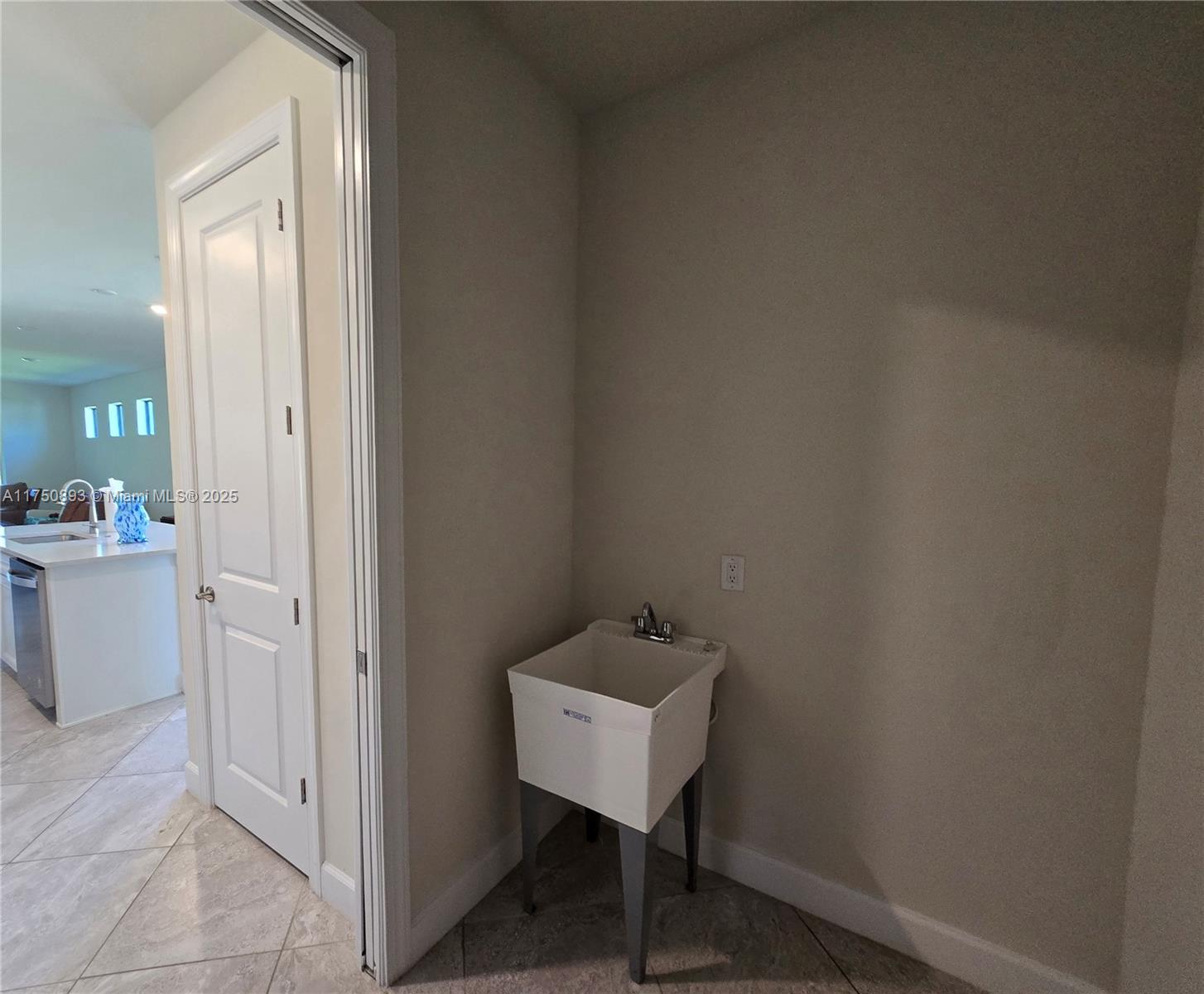 Ave Maria Immokalee, FL 34142 - Photo 8 of 21 a bathroom with a sink and a mirror