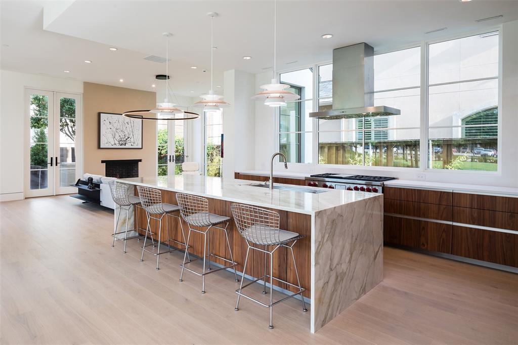 5048 Airline Road Highland Park, TX 75205 - Photo 13 of 36 a large kitchen with kitchen island granite countertop a large counter top and stainless steel appliances