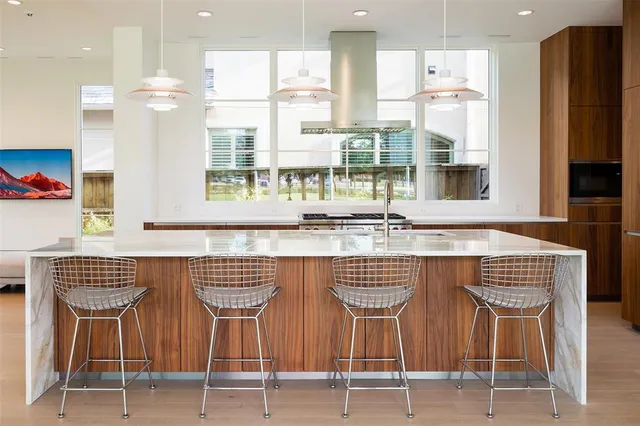 a dining table chair sitting next to a window