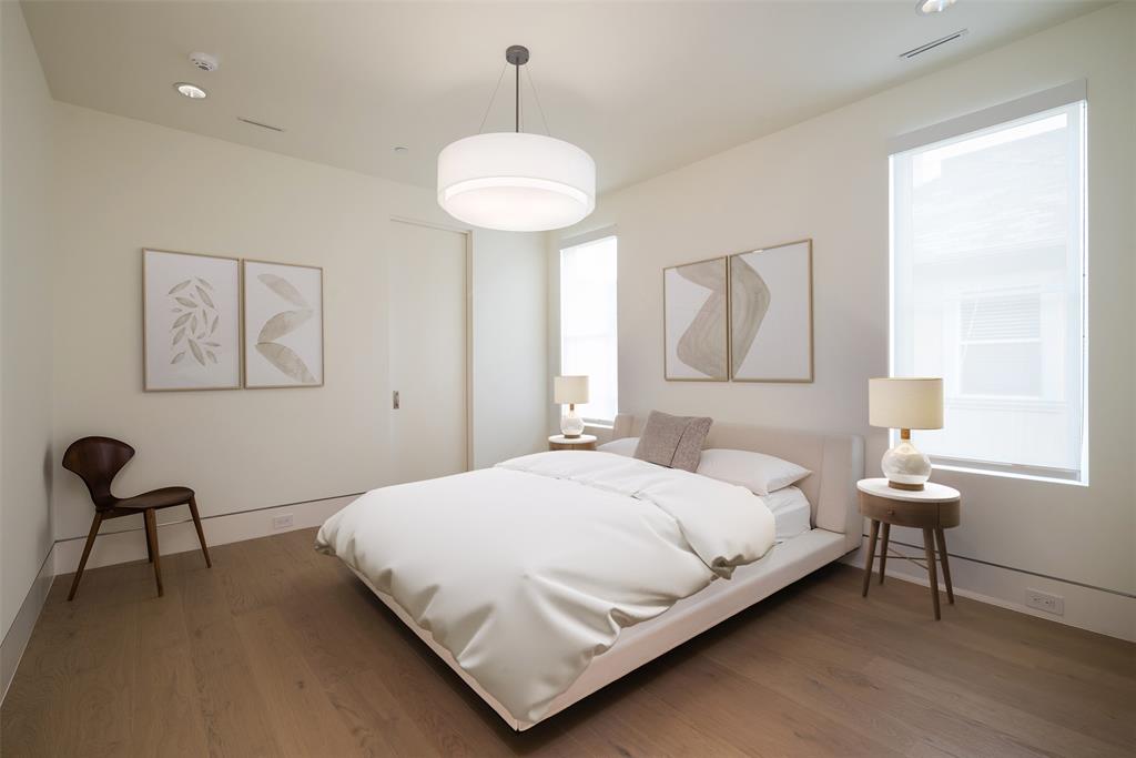 5048 Airline Road Highland Park, TX 75205 - Photo 25 of 36 a bedroom with a bed and a chair