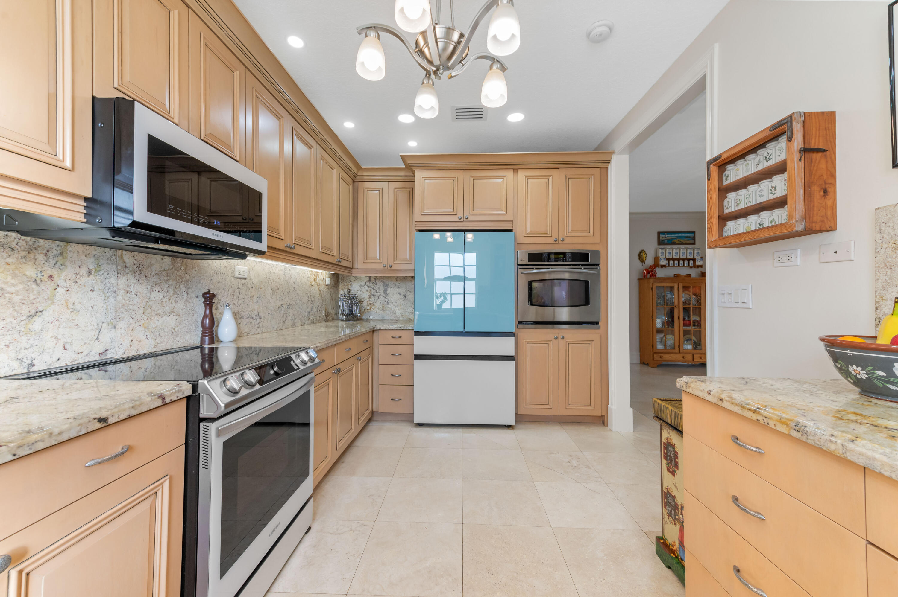 746 West Palmetto Park Road Boca Raton, FL 33486 - Photo 16 of 60 a kitchen with stainless steel appliances granite countertop a stove and a microwave