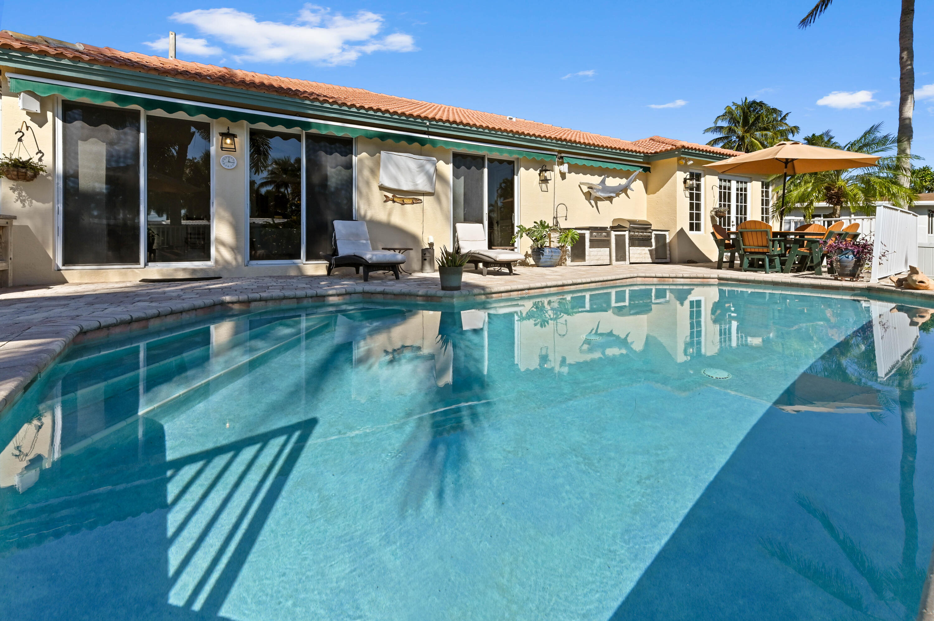 746 West Palmetto Park Road Boca Raton, FL 33486 - Photo 46 of 60 a view of swimming pool with outdoor seating